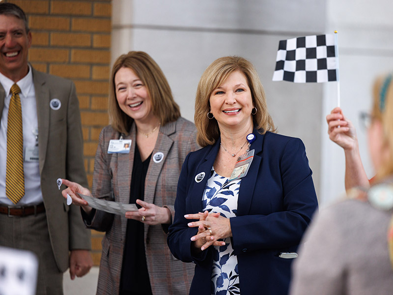 Executive Director of Communications and Marketing Marc Rolph, Assistant Vice Chancellor for Academic Affairs Dr. Natalie Gaughf and Vice Chancellor for Health Affairs Dr. LouAnn Woodward greet UMMC employees arriving at the Adult Hospital Monday morning to kick off Patient Safety Week.